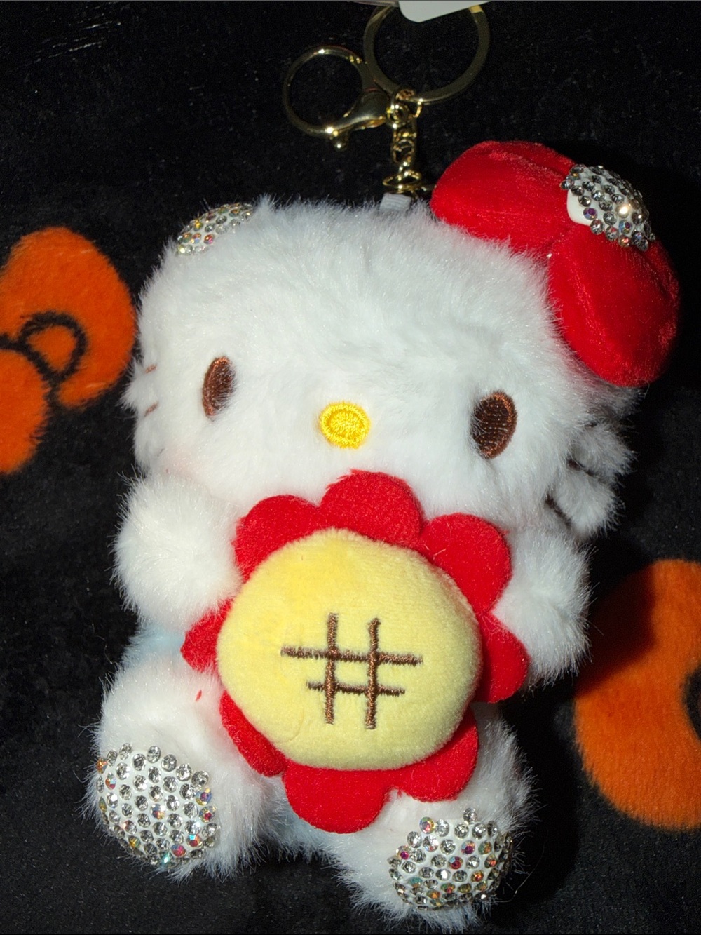 White Plush Kitty Keyring with Red Flower Accent no tale on kitty’s bottom